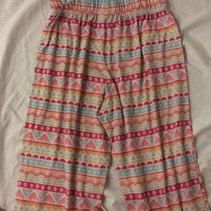 A pair of very well worn pajama pants.